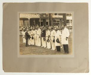 The Ashes. England v Australia 1934. &lsquo;Verity&rsquo;s Match&rsquo;. Two large mounted photographs from the match. The first shows the England team being introduced to Hedley Verity and the team on the pitch prior to the start of the match, the second features the mass