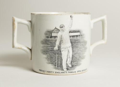 Hedley Verity. Yorkshire & England, 1930-39. A very scarce W. Ellis of Bramley commemorative two handled &lsquo;loving cup&rsquo; mug for &lsquo;Hedley Verity, England&rsquo;s Famous Spin Bowler&rsquo; with vignette of Verity in bowling pose. &lsquo;Record bowling by Hedley Verity&rsquo; to verso