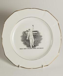 Hedley Verity, Yorkshire & England. Unusual commemorative ceramic plate for &lsquo;Hedley Verity, England&rsquo;s Famous Spin Bowler&rsquo; with transfer printed vignette of Verity in bowling pose and title to face. Gold lustre to inner and outer rim. To verso, a transfer 