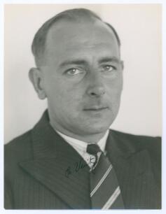 Hedley Verity. Yorkshire & England 1930-1939. Excellent mono press photograph of Verity, head and shoulders, wearing suit and tie. Very nicely signed in ink by Verity to image. The photograph by &lsquo;Photo Fischer. Parliament Chambers C.T.&rsquo; to verso. 6.5&rdquo;x8.5