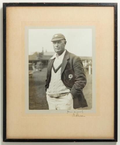 Wilfred Rhodes. Yorkshire & England 1898-1930. Excellent large original mono photograph of Rhodes, three quarter length, wearing cricket attire and his Yorkshire cap and blazer at a cricket ground. Very nicely signed &lsquo;Yours sincerely W. Rhodes&rsquo; to lower e