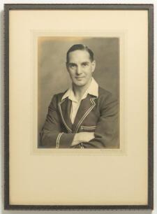 Herbert Sutcliffe, Yorkshire & England 1919-1945. Excellent studio portrait photograph of Sutcliffe, half length, wearing M.C.C. touring blazer. The photograph, by Walter Scott of Bradford, measures 6.5&rdquo;x8.5&rdquo; and is laid down to photographers mount. Frame