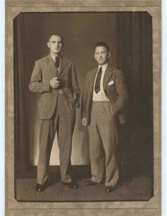 Hedley Verity, Yorkshire & England, 1930-39 and Maurice Leyland, Yorkshire & England 1920-1947. Excellent sepia studio portrait photograph of the two players, full length, wearing suits and ties, Verity holding a pipe in his right hand. The photograph, ta