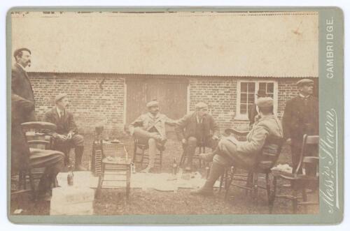 Kumar Shri Ranjitsinhji. Cambridge University, Sussex, London County & England 1893-1920. Early original sepia cabinet card photograph taken after a shooting party on the Glebe Estate, Methwold, Norfolk. Ranjitsinghji is depicted seated cross-legged to th