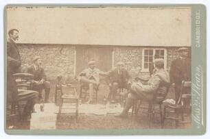 Kumar Shri Ranjitsinhji. Cambridge University, Sussex, London County & England 1893-1920. Early original sepia cabinet card photograph taken after a shooting party on the Glebe Estate, Methwold, Norfolk. Ranjitsinghji is depicted seated cross-legged to th