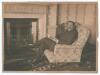 Kumar Shri Ranjitsinhji. Cambridge University, Sussex, London County & England 1893-1920. Excellent original sepia photograph of Ranjitsinhji in casual pose wearing suit and tie, seated in an armchair holding a magazine in front of a fireplace. The unmoun