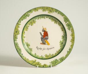 &lsquo;Ready for Chances&rsquo;. A Royal Doulton Black Boy dinner plate, entitled &lsquo;Ready for Chances&rsquo; printed with a boy in red shirt, yellow waistcoat and a floppy hat crouched awaiting a catch (as if in the slips). Green floral decoration to inner and outer rim. 9.