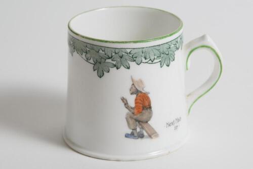 &lsquo;Next Man In&rsquo;. A small Royal Doulton Black Boy mug or tankard, entitled &lsquo;Next Man In&rsquo; printed, to one side, with a boy cricketer in red shirt, grey trousers and a floppy hat, sitting on his bat, waiting to go in, to verso, the crest &lsquo;The All Black Team&rsquo;. 