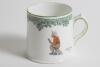 &lsquo;Next Man In&rsquo;. A small Royal Doulton Black Boy mug or tankard, entitled &lsquo;Next Man In&rsquo; printed, to one side, with a boy cricketer in red shirt, grey trousers and a floppy hat, sitting on his bat, waiting to go in, to verso, the crest &lsquo;The All Black Team&rsquo;. 