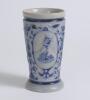 Westerwald stoneware cricket beaker, moulded in relief with three cameo panels of a batsman, after W.G. Grace, in different poses. The body highly decorated with vine and sprig decoration in cobalt blue on a grey background, with the figures highlighted i - 3