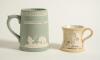Cricket mugs/tankards. Small Staffordshire 3&rdquo; waisted cricket mug with strap handle and beaded rim, with cream background and three raised figures in white of a batsman, bowler and wicket keeper, believed to be Lillywhite, Pilch and Box. c1870. Silver lus