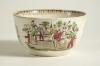 Village cricket bowl. Staffordshire 19th century bowl, transfer printed in black with three scenes of village cricket, with church and tents to background, floral and oak leaf inner rim decoration. Hand coloured in green, burgundy, and yellow. Approximat