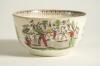 Village cricket bowl. Staffordshire 19th century bowl, transfer printed in black with three scenes of village cricket, with church and tents to background, floral and oak leaf inner rim decoration. Hand coloured in green, burgundy, and yellow. Approximat - 2