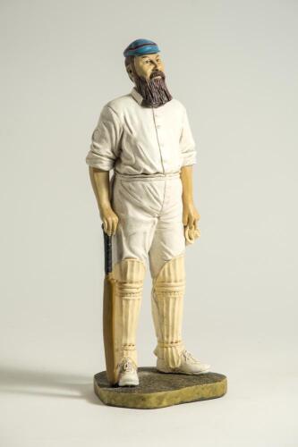 &lsquo;W.G. Grace&rsquo;?. Large modern figure of a bearded batsman wearing a blue and red hooped cap with bat and gloves in hands. The figure stands on grass base and signed &lsquo;Peter Mook 98&rsquo;. Approx 14.5&rdquo; tall. VG