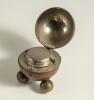 Cricket ball inkwell. Leather cricket ball ink well, well made with seam and stitched quarters. The ball, mounted on three ball feet, is split and hinged and opens to reveal a silver metal liner with an original glass ink well. Approximately 2.75&rdquo; circumf - 2