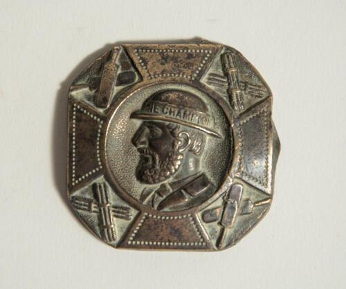 &lsquo;The Champion&rsquo;. Early brass cricket belt buckle of square form with rounded corner with head and shoulders image of a bearded cricketer wearing a bowler style hat with the legend &lsquo;The Champion&rsquo; to the hat band. The image of the cricketer at the centre of 