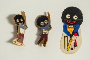 Robertson Golden Shred. Two metal golly cricketing lapel pin badges, each with maker&rsquo;s name to verso for Fattorini of Birmingham. 1.5&rdquo; tall. Sold with a similar paper golly label, 2&rdquo; tall. Good condition. Qty 3.