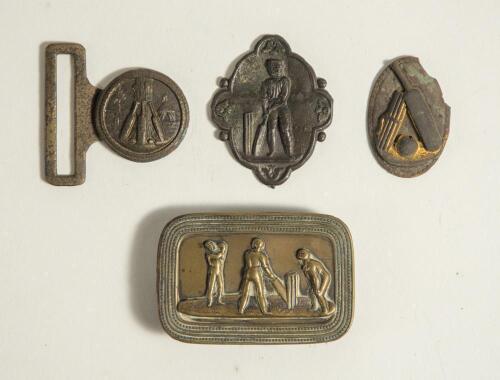 &lsquo;Cricketers at Play&rsquo;. Oblong shaped brass belt buckle with scene of a bowler bowling to a batsman with wicket-keeper behind the stumps, circa 1860/70&rsquo;s. Decorative border. Approximately 2.75&rdquo;x1.75&rdquo;. Good condition. Sold with a further small brass clasp d