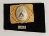 Cricket belt buckle. An excellent oblong shaped belt buckle in soft gilt metal overlaid with silver metal feature to centre, the circular centre decorated with crossed bats stumps and ball over a cricket tent, the outer borders with attractive decorative 