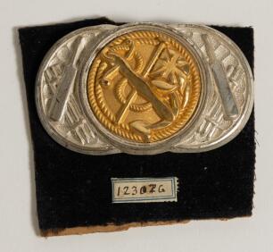 Cricket belt buckle. An excellent oblong shaped belt buckle in silver metal overlaid with soft gilt metal to centre, decorated with bats and sets of stumps to silver metal and the central image with Union jack flag intertwined with an anchor on a cord. Th