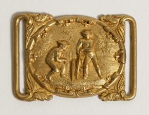 Cricket belt buckle. An excellent oblong shaped interconnecting belt buckle in soft gilt metal, the oval shaped centre features a cricket match in progress with batsman and wicket-keeper with tent and tress to background, decorative surrounds. Circa 1870.