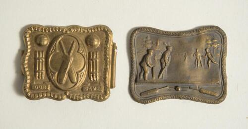 &lsquo;Our Game&rsquo;. Cricket belt buckle. Two oblong shaped brass belt buckles, one with crossed bats within an oval to centre, balls sets of stumps and beaded border with title to base of the stumps &lsquo;Our Game&rsquo;. Modern wire fixing soldered to back otherwise in goo