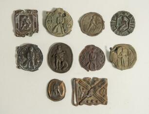 Cricket belt buckles. A selection of buckles, all with faults, and some metal band brass motifs used to decorate and enhance belt buckles. The buckles include a circular buckle with batsman at the wicket, a batsman with bat under his arm, a batsman playin