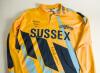 Neil John Lenham. Sussex 1984-1997. Sussex yellow &lsquo;AXA&rsquo; Sunday League shirt with blue and black trim by Hogger Sports. &lsquo;Sussex&rsquo;, martlets emblem and &lsquo;Merrydown&rsquo; sponsor&rsquo;s logo to front. Player&rsquo;s name and &lsquo;Axa&rsquo; logo to reverse. The shirt worn by Lenham in 