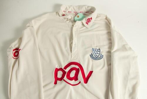 Jason Lewry. Sussex 1994-2009. Sussex white first XI cricket shirt worn by Lewry during the Sussex Championship winning season of 2006. The shirt with &lsquo;Sussex&rsquo;, martlets emblem and &lsquo;PAV I.T.&rsquo; sponsor&rsquo;s logo to front and collars. Sponsor &lsquo;Liverpool Victori