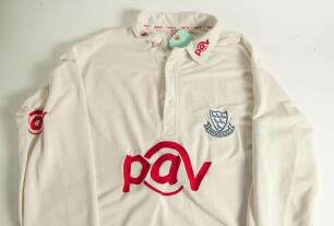 Jason Lewry. Sussex 1994-2009. Sussex white first XI cricket shirt worn by Lewry during the Sussex Championship winning season of 2006. The shirt with &lsquo;Sussex&rsquo;, martlets emblem and &lsquo;PAV I.T.&rsquo; sponsor&rsquo;s logo to front and collars. Sponsor &lsquo;Liverpool Victori