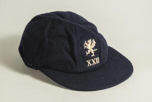 Peter William Denning. Somerset 1969-1984. Somerset 2nd XI cap worn by Denning during his playing career with Somerset. The navy blue cap, by Foster of London, with the Somerset emblem of a wyvern/dragon embroidered in white and a touch of red to the fron