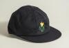 Glamorgan C.C.C. navy blue cloth 1st XI cricket cap with embroidered Glamorgan emblem of the daffodil in bloom to front. Owner unknown. Small moth hole to edge of the peak otherwise in very good condition
