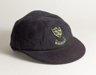 Reverend David Stuart Sheppard. Cambridge University, Sussex & England 1950-1964. Sussex navy blue 1st XI cloth cricket cap worn by Sheppard during his playing career. The cap, by W.V. Brown of Eton, embroidered with the six martlet&rsquo;s emblem of Sussex to 