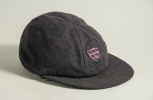 George Hubert Graham Doggart. Cambridge University, Sussex & England 1948-1961. Sussex navy blue 1st XI cloth cricket cap worn by Doggart during his playing career. The cap, by Foster of London, embroidered with the six martlet&rsquo;s emblem of Sussex to front
