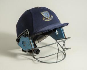 Sussex 1st XI navy blue batting helmet with grill with Sussex emblem to front, The helmet, made by Albion C&D of Australia. The helmet with signs of wear otherwise in good original used condition. Player unknown