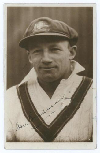 Donald George Bradman. New South Wales, South Australia & Australia 1927-1949. Excellent plain back sepia real photograph postcard of Bradman, head and shoulders, wearing Australian touring cap and sweater. The postcard very nicely signed by Bradman in in