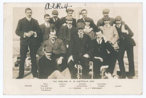 &lsquo;The England XI in Australia 1904&rsquo;. Early sepia real photograph postcard of the England team on board ship, with title and players names printed to lower border. Signed in black ink to the front by A.E. Relf, and to verso by Tom Hayward. Others featured i