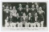 The Ashes. England v Australia 1930. Official mono real photograph postcard of the England team seated and standing in rows wearing cricket attire and assorted blazers. Printed title &lsquo;First Test Team&rsquo; and players&rsquo; names to lower border. Players featured i