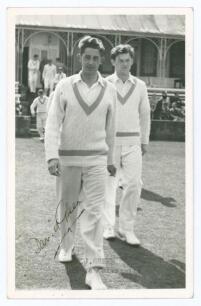 David John Green. Derbyshire & Cambridge University 1953-1960. Mono real photograph plain back postcard of Green entering the field of play for Cambridge University followed by Roger Prideaux. Nicely signed in black ink to the photograph, &lsquo;David Green&rsquo;. T