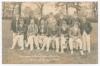 Gloucestershire C.C.C. c.1907. Early sepia real photograph postcard of the Gloucestershire team seated and standing in rows wearing assorted blazers and caps. Title to lower edge &lsquo;Gloucestershire [sic] Trial Match at Moreton. The Gloucester [sic] County T
