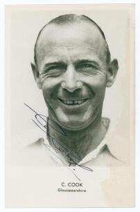 Cecil &lsquo;Sam&rsquo; Cook. Gloucestershire & England 1946-1964. Mono real photograph postcard of Cook, head and shoulders wearing cricket attire. Nicely signed in blue ink to the photograph &lsquo;C. Cook&rsquo;. Sporting Handbooks Ltd., London. Postally unused. Some staining