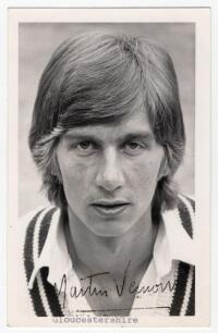 Martin Jeffery Vernon. Middlesex & Gloucestershire 1974-1976. Rarer mono real photograph plain back postcard of Vernon, head and shoulders wearing cricket attire. Signed in black ink to the lower margin &lsquo;Martin Vernon&rsquo;, typed title below. Photograph by Bi