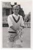 Roy Swetman. Surrey, Nottinghamshire, Gloucestershire & England 1954-1974. Mono real photograph plain back postcard of Smith, three quarter length, walking on to the pitch donning his wicket-keeping gloves. Nicely signed in black ink to the photograph &lsquo;R.