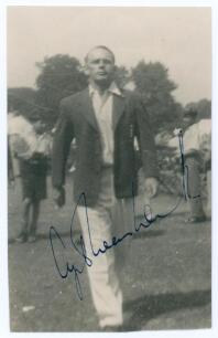Cyril Washbrook. Lancashire & England 1933-1959. Mono real photograph candid style plain back postcard of Washbrook depicted walking purposefully on the outfield wearing an England blazer. Very nicely signed in blue ink to the photograph by Washbrook. Ann