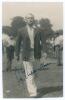 Cyril Washbrook. Lancashire & England 1933-1959. Mono real photograph candid style plain back postcard of Washbrook depicted walking purposefully on the outfield wearing an England blazer. Very nicely signed in blue ink to the photograph by Washbrook. Ann