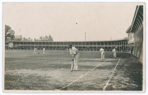 Leicestershire C.C.C. c.1920. Original mono real photograph postcard of members of the Leicestershire team practising on the outfield at Grace Road (?), with a sweeping grandstand in the background. Baxter&rsquo;s Photo Series, Hinckley. Minor creasing and wear