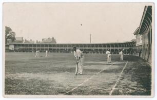 Leicestershire C.C.C. c.1920. Original mono real photograph postcard of members of the Leicestershire team practising on the outfield at Grace Road (?), with a sweeping grandstand in the background. Baxter&rsquo;s Photo Series, Hinckley. Minor creasing and wear