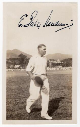 Elias Henry &lsquo;Patsy&rsquo; Hendren. Middlesex & England 1907-1937. Mono real photograph plain back postcard of Hendren walking off the field, cap in hand, while on tour in the West Indies, date unknown. Boldly signed in black ink to the photograph &lsquo;E. Patsy Hend