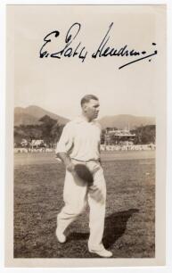 Elias Henry &lsquo;Patsy&rsquo; Hendren. Middlesex & England 1907-1937. Mono real photograph plain back postcard of Hendren walking off the field, cap in hand, while on tour in the West Indies, date unknown. Boldly signed in black ink to the photograph &lsquo;E. Patsy Hend