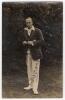 Arthur William Carr. Nottinghamshire & England 1910-1934. Original sepia real photograph postcard of Carr standing full length wearing M.C.C. touring blazer. Signed in black ink to the photograph &lsquo;A.W. Carr&rsquo;. Publisher unknown. Minor wear to corners, some